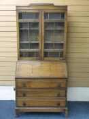 AN EDWARDIAN BUREAU BOOKCASE with three base drawers