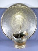 BRASS CHARGER, 85cms D and a brass helmet coal scuttle