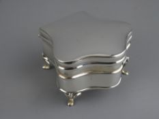 SHAPED SILVER TRINKET BOX, Birmingham 1919, maker John and William Deakin, raised on four feet, 7.