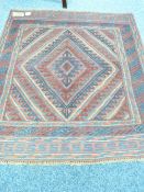 CAZAK RUG - tonal red and blue ground with singular diamond central pattern and triple bordered