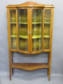EDWARDIAN CHINA CABINET with convex central glazed doors, lower shelf, railback top and inlaid