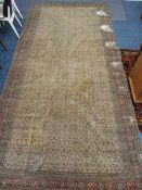 ANTIQUE RUG on red ground, 380 x 172cms