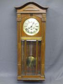 PENDULUM WALL CLOCK of plain form with silver dial, bevelled glass panelled front and D.P marked