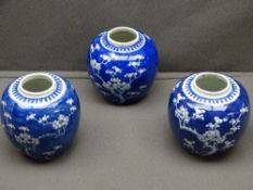 PRUNUS BLOSSOM GINGER JARS, three similar and all with concentric circles to the base