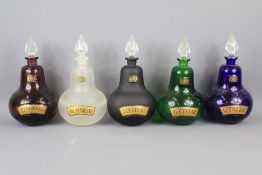 Four Inverted Teardrop Glass Apothecary Bottles