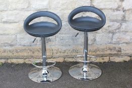 A Pair of Contemporary Chrome and Leather Bar Stools
