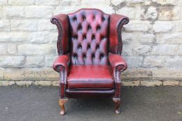 A Claret Leather Button Back Wing-back Chair