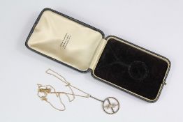 A Lady's Antique Platinum and Diamond Disc Pendant