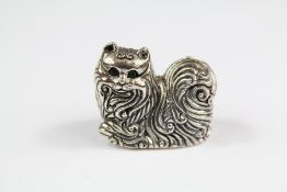 A Cast Silver Figure of a Seated Cat