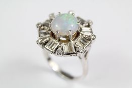 A Platinum Mounted Opal and Diamond Ring