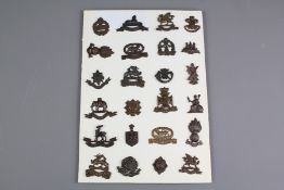 A Carded Display of Twenty Officers Collar Badges