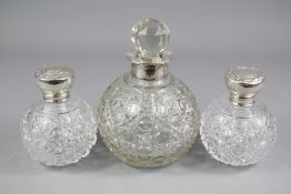 Two Victorian Cut-glass Silver Topped Perfume Bottles