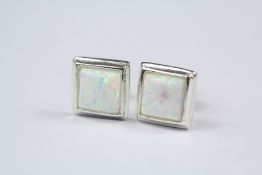 A Pair of Silver and Opal Stud Earrings