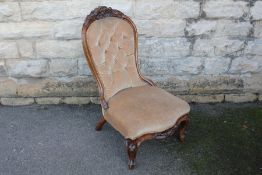 A Walnut Framed Nursing Chair