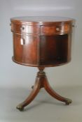 A Mahogany Revolving Drum Table