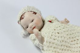 A Victorian Miniature Porcelain Doll
