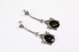 A Pair of Silver Drop Earrings