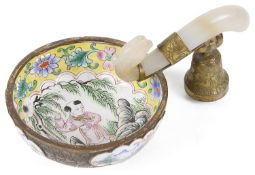 A 19th century Chinese Canton enamel libation cup with carved jade handle