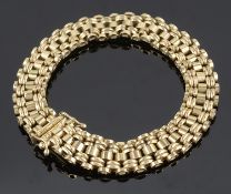 A 9ct gold articulated bracelet of bar link design