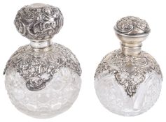 Two globular cut glass and silver scent bottles