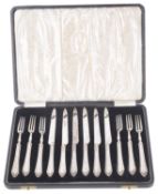 A suite of cased EPNS handled fruit knives and forks,