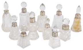 A collection of glass and silver perfume bottles