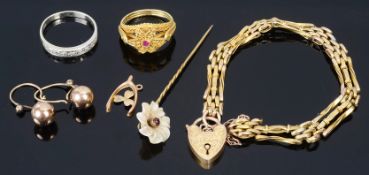 An 18ct gold ruby set filigree ring of floral design