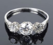 An attractive Edwardian three stone diamond set ring,