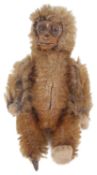 A Schuco jointed miniature monkey
