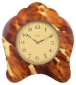 A faux tortoiseshell travelling clock