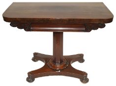 A Victorian mahogany fold over card table
