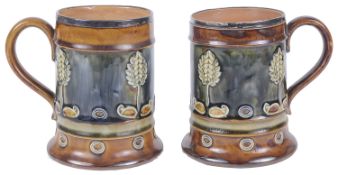 A pair of Royal Doulton stoneware silver rimmed tankards