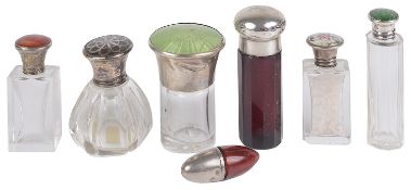 A collection of silver and enamel topped bottles and others