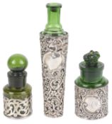 Three silver and emerald green glass perfume bottles