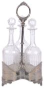 A silver plated decanter holder, with three cut glass decanters, early 20th century