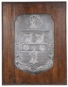 A wooden mounted shield plaque bearing coat of arms for Rugby School by Fisher and Ludlow