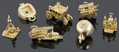A charming contemporary collection of seven 9ct mostly articulated charms