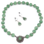 A pair of amusing art deco carved jade Buddha drop earrings