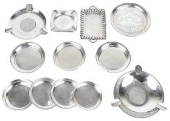A collection of silver ashtrays