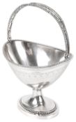 A Dutch neo-classical silver swing handled sugar basket, Amsterdam 1851, with makers mark W.V