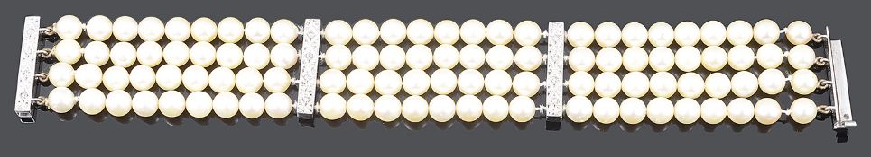 A Continental four row cultured pearl and diamond bar set bracelet