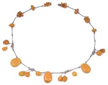 A mid 20th c. Russian silver mounted amber necklace and a mid 20th c. Continental amber necklaces