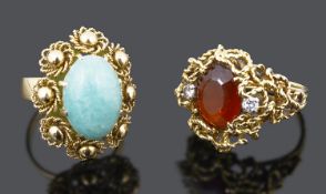 Two large contemporary gold mounted dress rings