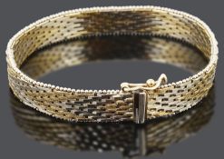 A contemporary 9ct gold brick link woven bracelet