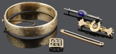 A Victorian two colour gold horseshoe brooch