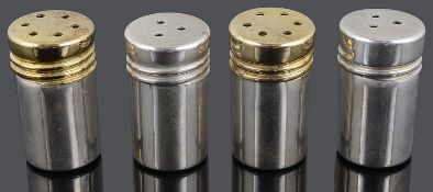 A set of four sterling silver shotgun cartridge salt and pepper pots by Tiffany and Co.