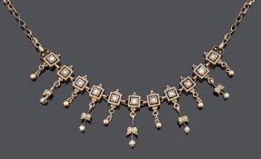 A delicate 19th c. seed pearl set foliate fringe drop necklace
