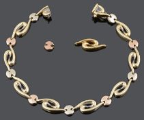A contemporary 9ct rose and yellow gold fancy scroll link bracelet