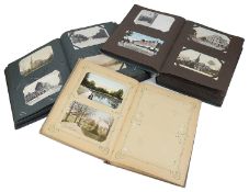 An extensive collection of postcards in three albums