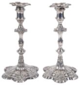 A pair of George II silver candlesticks